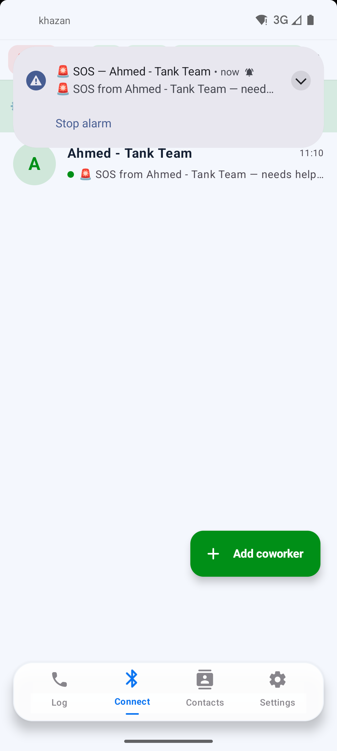 SOS alert arriving on a coworker's phone with a Stop alarm button